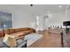 Bright living room featuring hardwood floors, a comfortable seating area, and great natural light at 818 Calluna St, Las Vegas, NV 89138