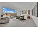 Bright main bedroom featuring a patio view, modern furniture, and contemporary artwork at 818 Calluna St, Las Vegas, NV 89138