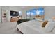 Bright main bedroom features a pool view, TV, sitting area, and tile floors at 818 Calluna St, Las Vegas, NV 89138