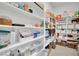 Walk-in pantry featuring organized shelves filled with various food items and household supplies at 818 Calluna St, Las Vegas, NV 89138