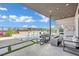 Inviting patio with a fire pit, lounge seating, and stunning views of the backyard and pool at 818 Calluna St, Las Vegas, NV 89138