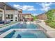Amazing pool area with an outdoor kitchen, water features, and meticulously kept landscaping at 818 Calluna St, Las Vegas, NV 89138