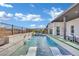 Inviting pool with water features, lounge chairs, and a beautifully landscaped backyard at 818 Calluna St, Las Vegas, NV 89138