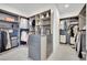 This walk-in closet is designed with custom shelving, ample storage, and a center island for organization at 818 Calluna St, Las Vegas, NV 89138