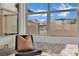 Bright window nook with modern windows offering views of the home's exterior and beautiful blue sky at 818 Calluna St, Las Vegas, NV 89138