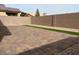 Spacious backyard featuring brick pavers and a strip of green grass at 8628 Vondel Park St, Las Vegas, NV 89148