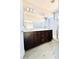 Bathroom featuring dual sinks and a glass-enclosed shower at 8628 Vondel Park St, Las Vegas, NV 89148