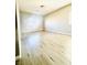 Light and airy bedroom with wood flooring and a large window at 8628 Vondel Park St, Las Vegas, NV 89148