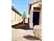 Charming walkway leading to the front door, with rock landscaping and gate at 8628 Vondel Park St, Las Vegas, NV 89148