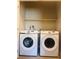 Laundry room with side-by-side Samsung washer and dryer, and shelving above at 8628 Vondel Park St, Las Vegas, NV 89148