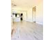 Bright, open living room with modern wood flooring and neutral paint at 8628 Vondel Park St, Las Vegas, NV 89148