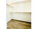 Spacious walk-in closet with wood flooring and shelving at 8628 Vondel Park St, Las Vegas, NV 89148