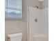 A tiled shower stall features sleek fixtures and an adjustable shower head at 1004 Country Skies Ave, Las Vegas, NV 89123