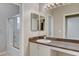 Bathroom features a sink with storage and a bathtub with shower combo at 1004 Country Skies Ave, Las Vegas, NV 89123