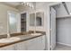Bathroom with double vanity, framed mirrors, and closet at 1004 Country Skies Ave, Las Vegas, NV 89123