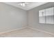 Neutral bedroom with tile flooring, a window, and a ceiling fan at 1004 Country Skies Ave, Las Vegas, NV 89123