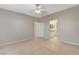 Bedroom featuring tile floors, ceiling fan, and ensuite bathroom access at 1004 Country Skies Ave, Las Vegas, NV 89123