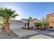Charming single-story home with well-manicured landscaping and attached garage at 1004 Country Skies Ave, Las Vegas, NV 89123
