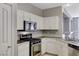 Well-equipped kitchen featuring stainless steel appliances and white cabinets at 1004 Country Skies Ave, Las Vegas, NV 89123