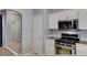 Modern kitchen features stainless steel appliances and white cabinets at 1004 Country Skies Ave, Las Vegas, NV 89123