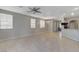 Open-concept living area with tile flooring, ample natural light, and seamless flow to the kitchen at 1004 Country Skies Ave, Las Vegas, NV 89123