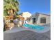 Beautiful pool with a charming pergola and seating area, perfect for outdoor relaxation at 1004 Country Skies Ave, Las Vegas, NV 89123