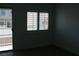 Bedroom with a window and sliding door to a balcony at 1066 Slate Crossing Ln # 3, Henderson, NV 89002