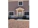 Inviting home entrance with a security screen door and well-maintained landscape at 1066 Slate Crossing Ln # 3, Henderson, NV 89002