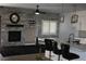 Open-concept living space featuring a fireplace, modern lighting, and barstool seating at 1066 Slate Crossing Ln # 3, Henderson, NV 89002
