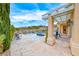 Inviting backyard featuring a covered patio and a pool, perfect for outdoor entertaining at 11593 Glowing Sunset Ln, Las Vegas, NV 89135