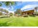 Clubhouse with beautiful desert landscaping and shade trees at 11593 Glowing Sunset Ln, Las Vegas, NV 89135