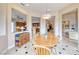 Bright dining room offers views into other rooms and has bright recessed lighting at 11593 Glowing Sunset Ln, Las Vegas, NV 89135