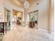 Elegant foyer with high ceilings, marble floors, a crystal chandelier, and stylish decor at 11593 Glowing Sunset Ln, Las Vegas, NV 89135