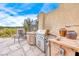 Outdoor kitchen featuring a built-in stainless steel grill and ample counter space at 11593 Glowing Sunset Ln, Las Vegas, NV 89135