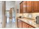 Bright kitchen features granite countertops, and well-lit cabinets for storage at 11593 Glowing Sunset Ln, Las Vegas, NV 89135