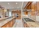 Gourmet kitchen featuring granite countertops, stainless steel appliances, and ample cabinet space at 11593 Glowing Sunset Ln, Las Vegas, NV 89135