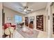 Cozy office space featuring a ceiling fan, built-in bookcases, and a comfortable work area at 11593 Glowing Sunset Ln, Las Vegas, NV 89135