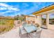 Outdoor dining area with a built-in grill, fireplace and comfortable seating perfect for entertaining at 11593 Glowing Sunset Ln, Las Vegas, NV 89135