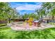 Community playground featuring modern play equipment, shaded benches, and manicured landscaping at 11593 Glowing Sunset Ln, Las Vegas, NV 89135