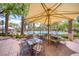 Community pool with table seating and shade at 11593 Glowing Sunset Ln, Las Vegas, NV 89135