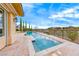 Stunning pool with travertine surround and breathtaking views, perfect for relaxation and entertaining at 11593 Glowing Sunset Ln, Las Vegas, NV 89135