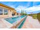 Backyard with a sparkling pool and desert landscaping, perfect for enjoying the outdoors at 11593 Glowing Sunset Ln, Las Vegas, NV 89135