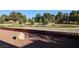 Backyard features a decorative retaining wall, gravel and large rock at 1211 Bourbon St, Pahrump, NV 89048