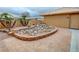 Backyard patio features unique rock garden and brick accents at 1211 Bourbon St, Pahrump, NV 89048