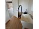 Half-bath off the garage features utility sink and tile floor at 1211 Bourbon St, Pahrump, NV 89048