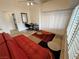 Bedroom featuring large windows with shutter style blinds and modern decor at 1211 Bourbon St, Pahrump, NV 89048