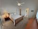 Bright bedroom featuring carpet flooring, a bed, and ceiling fan at 1211 Bourbon St, Pahrump, NV 89048