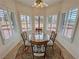 Cozy breakfast nook with shuttered windows and a decorative light fixture at 1211 Bourbon St, Pahrump, NV 89048