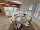 Bright breakfast nook with a round table, comfortable chairs, and shuttered windows at 1211 Bourbon St, Pahrump, NV 89048