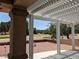 Covered patio featuring a pergola overlooking the backyard at 1211 Bourbon St, Pahrump, NV 89048